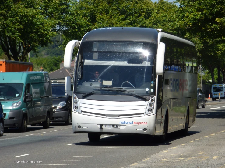 a bus that is driving down a street