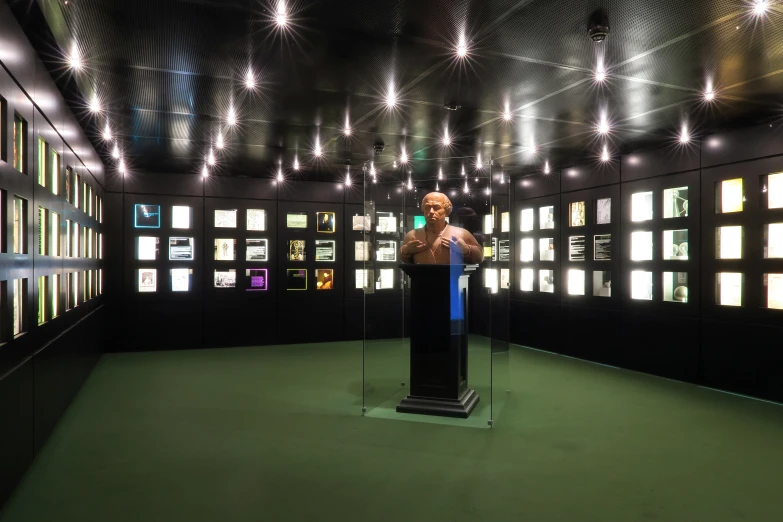 a woman standing at a podium in a room