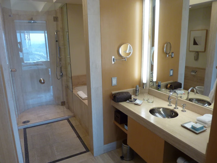 this bathroom has a shower, sink and toilet in it