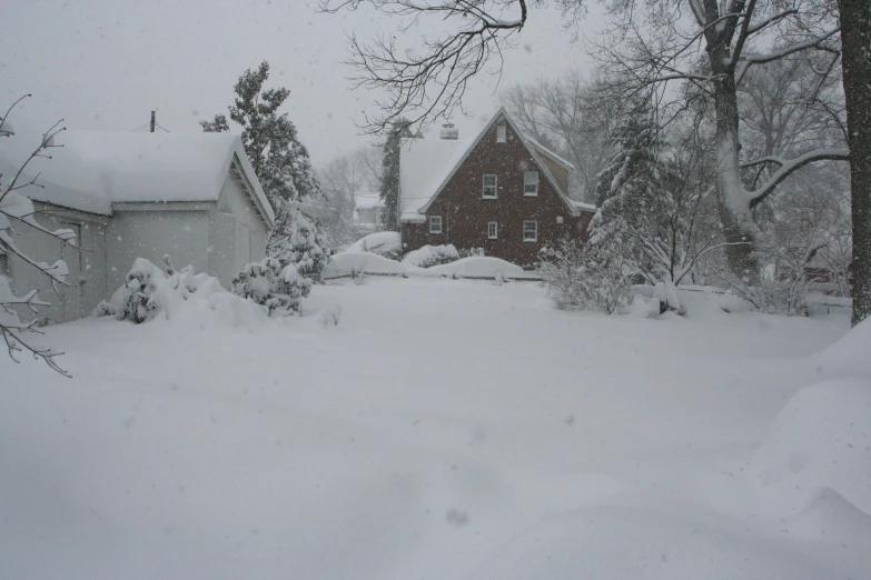 the house has snow piled up all around it