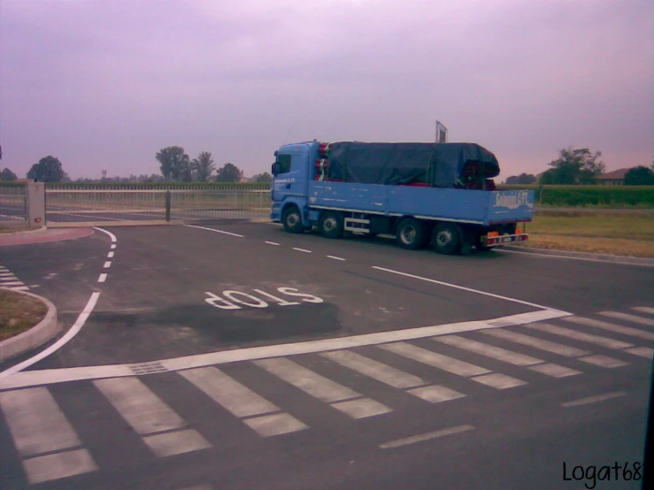 a large truck is parked in an empty parking lot