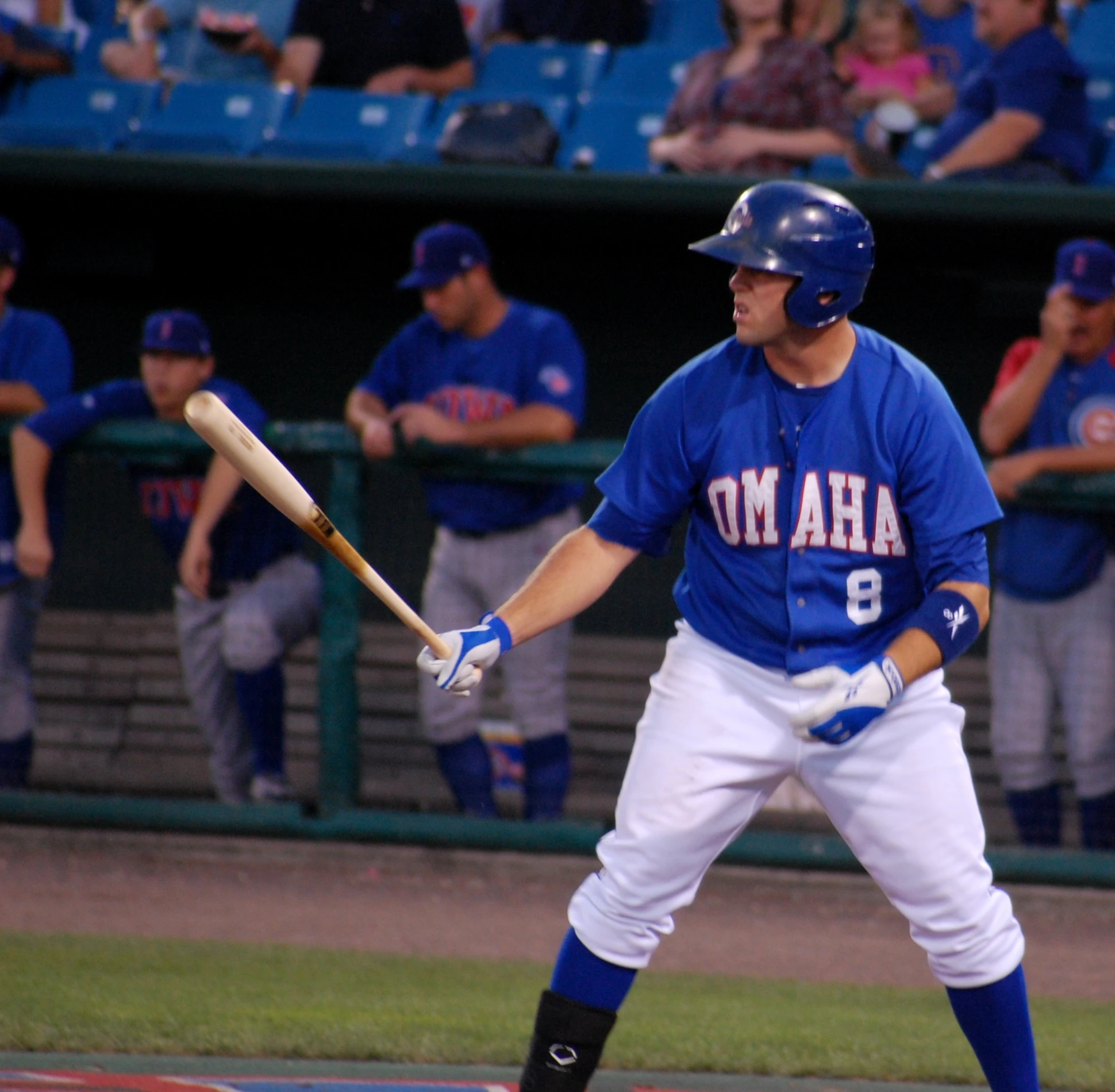 the baseball player is standing with his bat