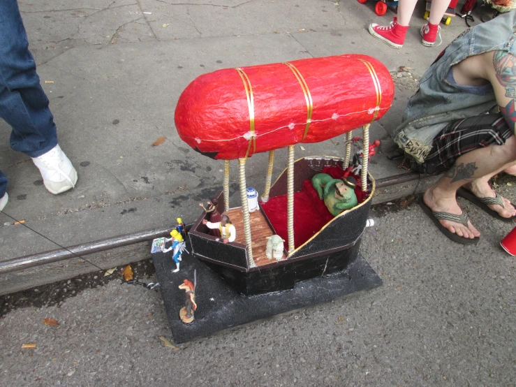 the large red object is attached to the pipe