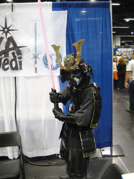 a man in costume is standing at an exhibit