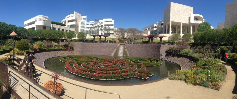 a well constructed area with many flowers and buildings