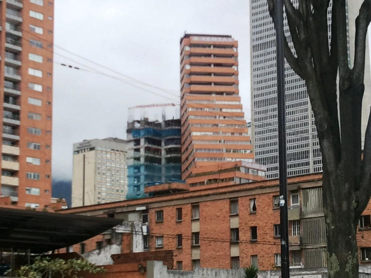 some buildings with cars parked in front of them