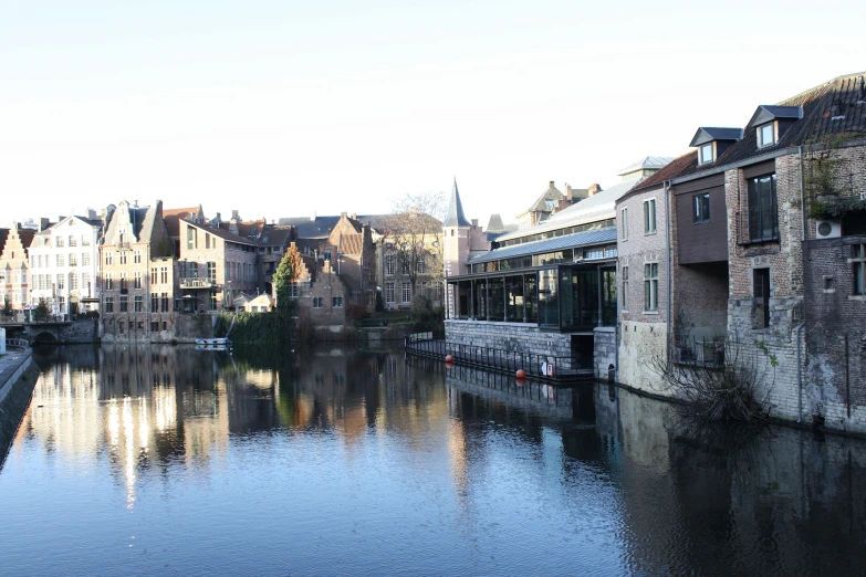 a waterway running along side a couple of buildings