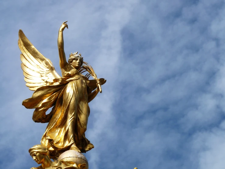 a statue that looks like it has its wings spread