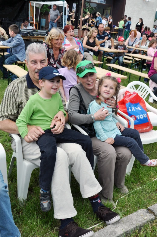 a group of people sitting in chairs at an event