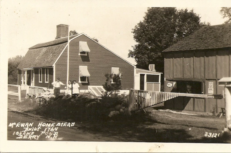 an old black and white po shows a red brick house