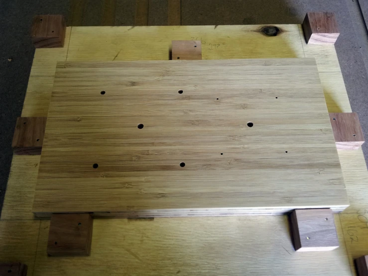 a wooden table topped with wooden planks and wood pieces