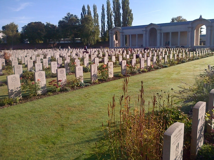 a bunch of tombstones in a very nice looking field