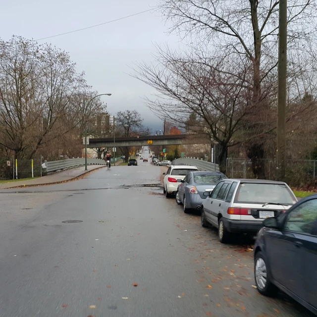 several cars parked on the side of the road