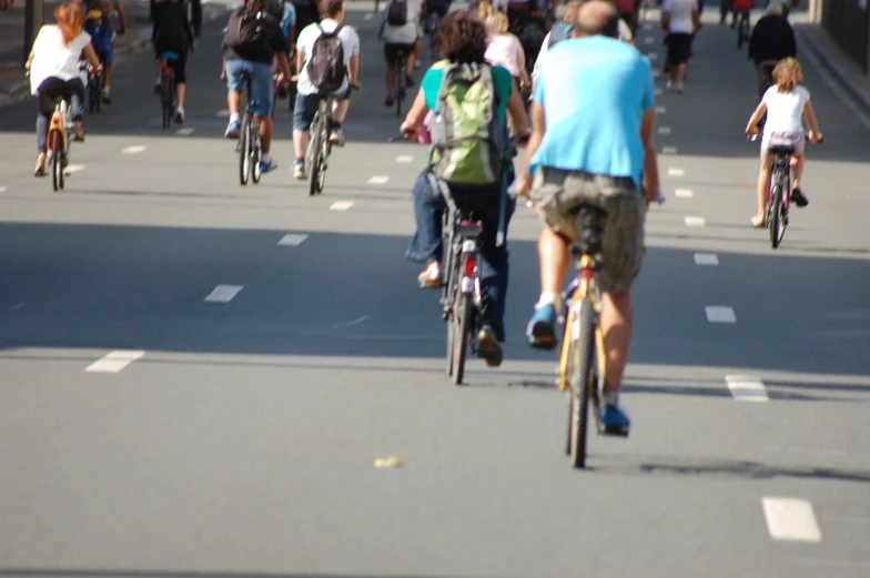 many people ride bicycles on the road