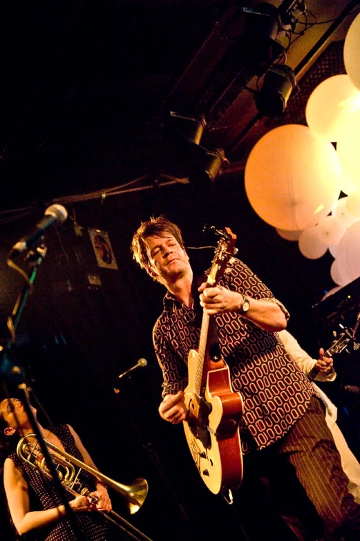 a man is playing with his instruments at the concert