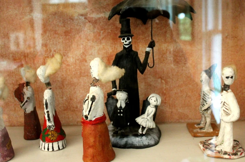 several different models and figurines are in a case