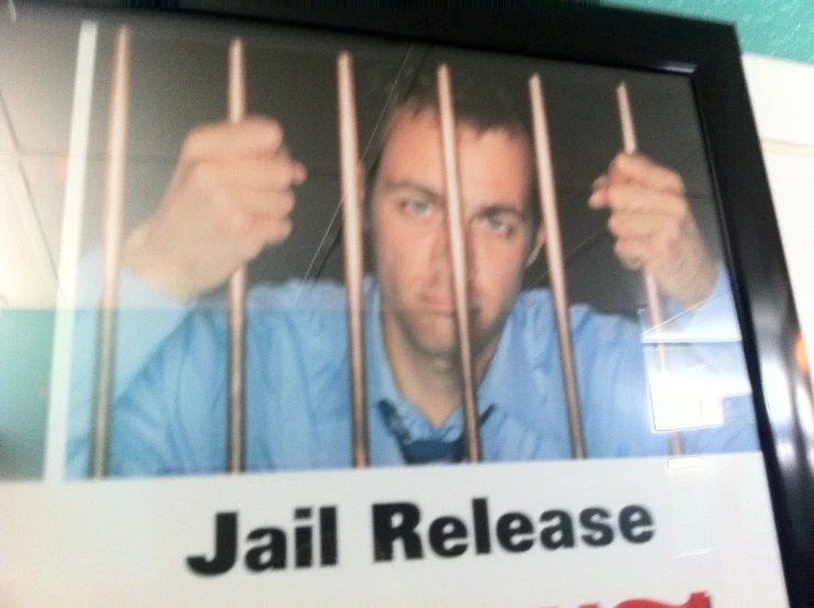 a po frame showing  release with an image of the person behind bars