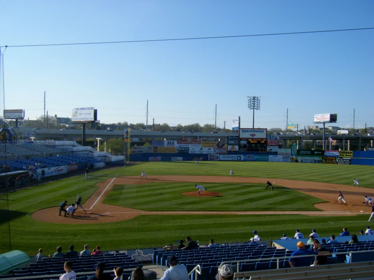 the men are playing baseball on the field