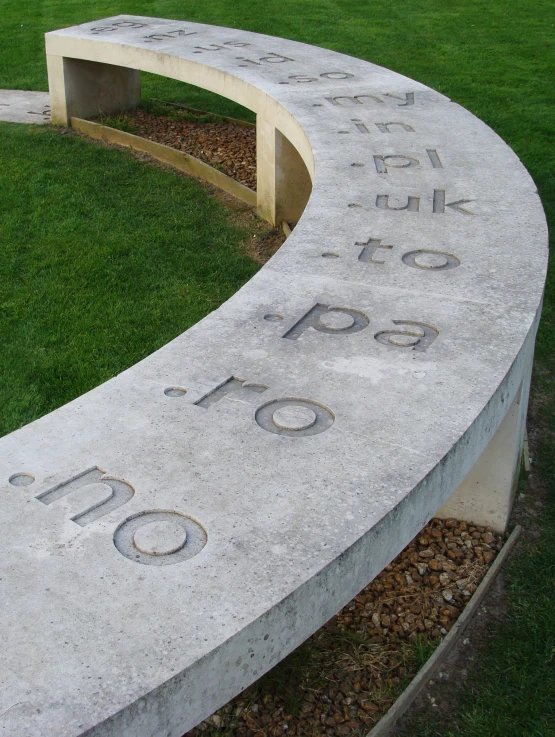 a cement sign with the words 100 and 10 on it