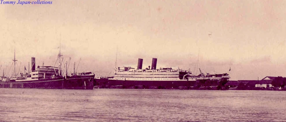 an old po of two large boats on the water