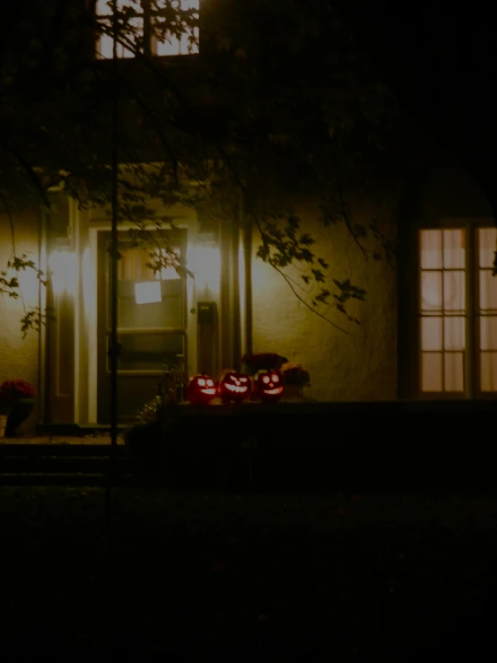 a house with lots of dark lighting in the evening