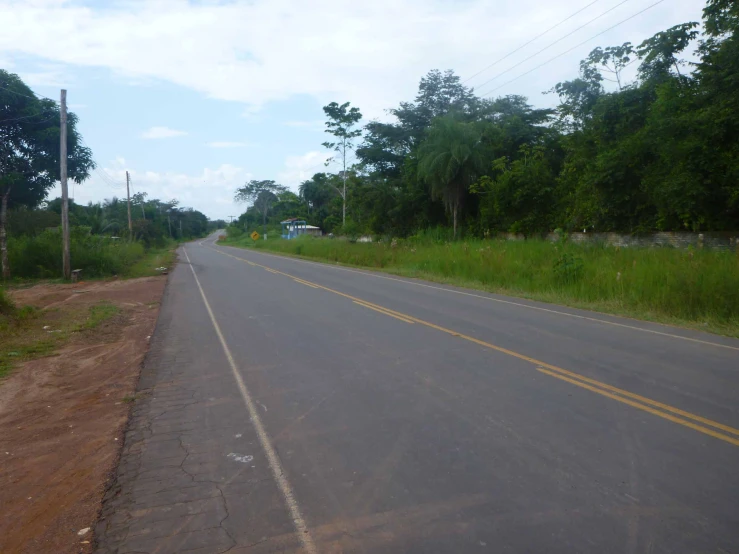 the road that is empty and empty with some signs on it