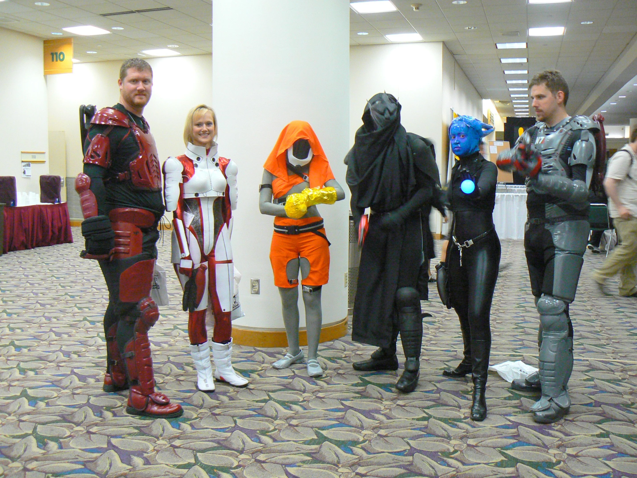 several people in costume standing next to each other