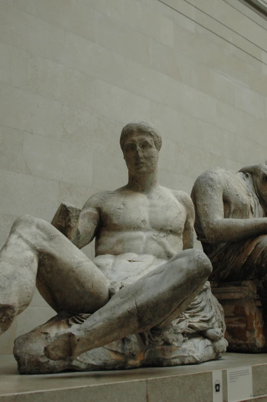 a close up of two statues sitting together