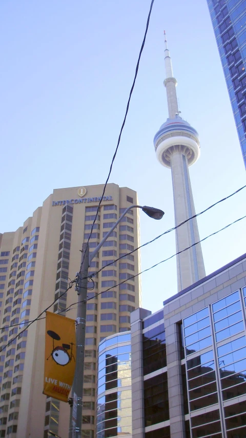 cityscape of buildings, including the space needle, against a blue sky