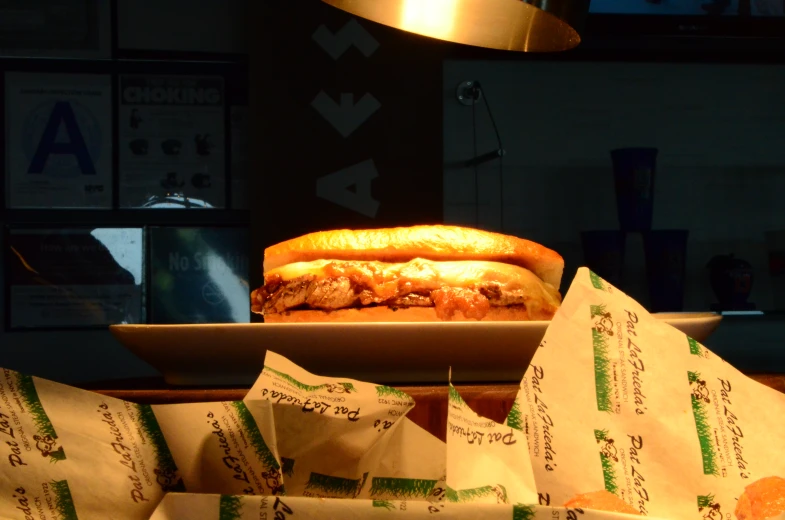 an unwrapped sub sandwich being displayed on the counter