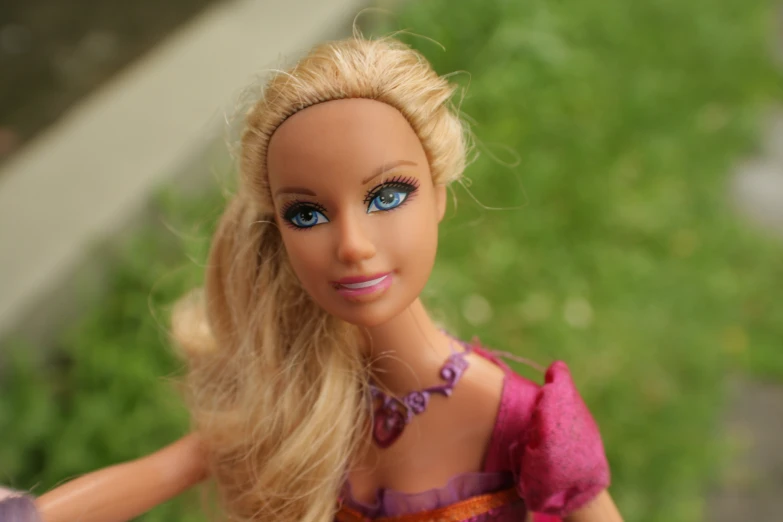 a doll with blue eyes and long blond hair