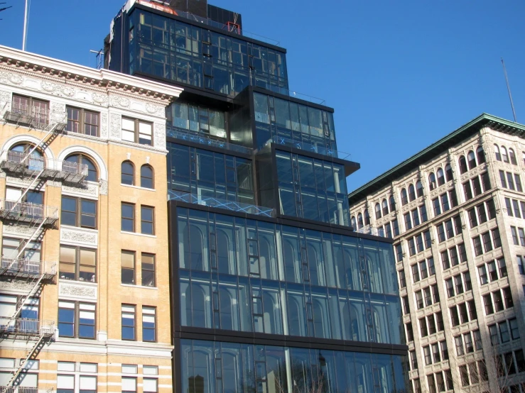 some large building with big windows and a sky background