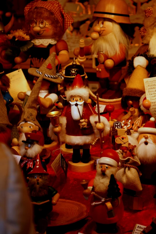 several santa claus dolls sitting in front of the music player