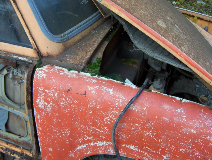 a dirty truck with the front end of it's doors missing