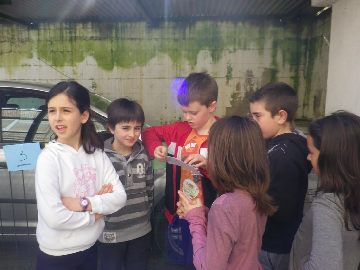 a group of children standing next to each other