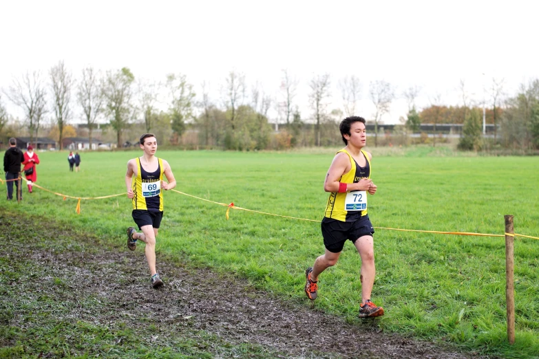 two people race on some grassy hills