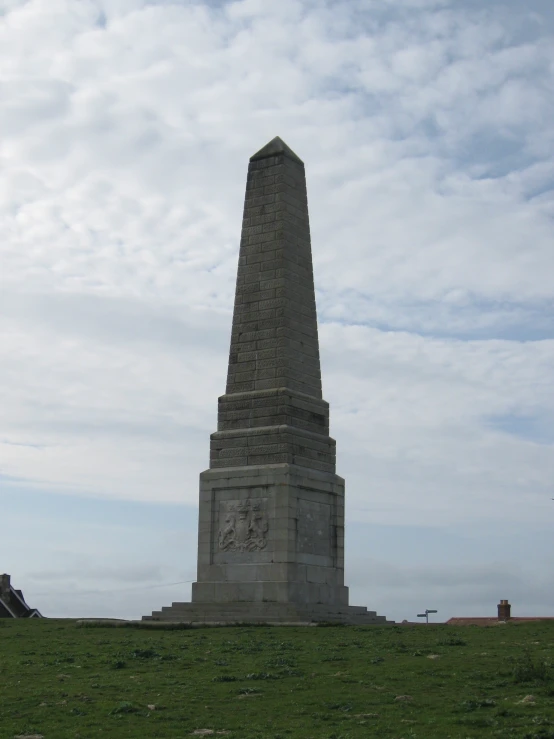 a large monument that has a clock on top of it