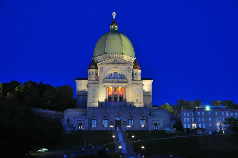 the dome of an old building with lights on