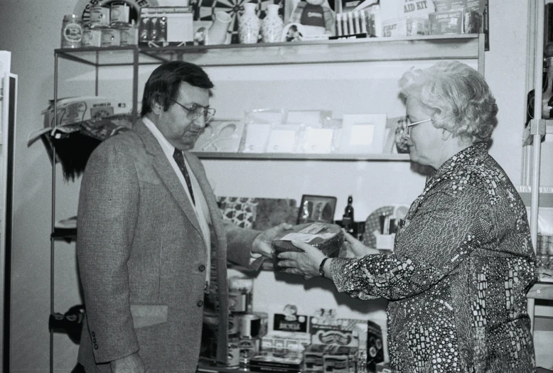 two older people standing next to each other