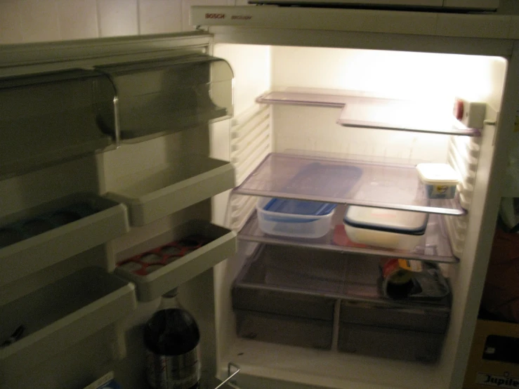 an empty refrigerator has food in it