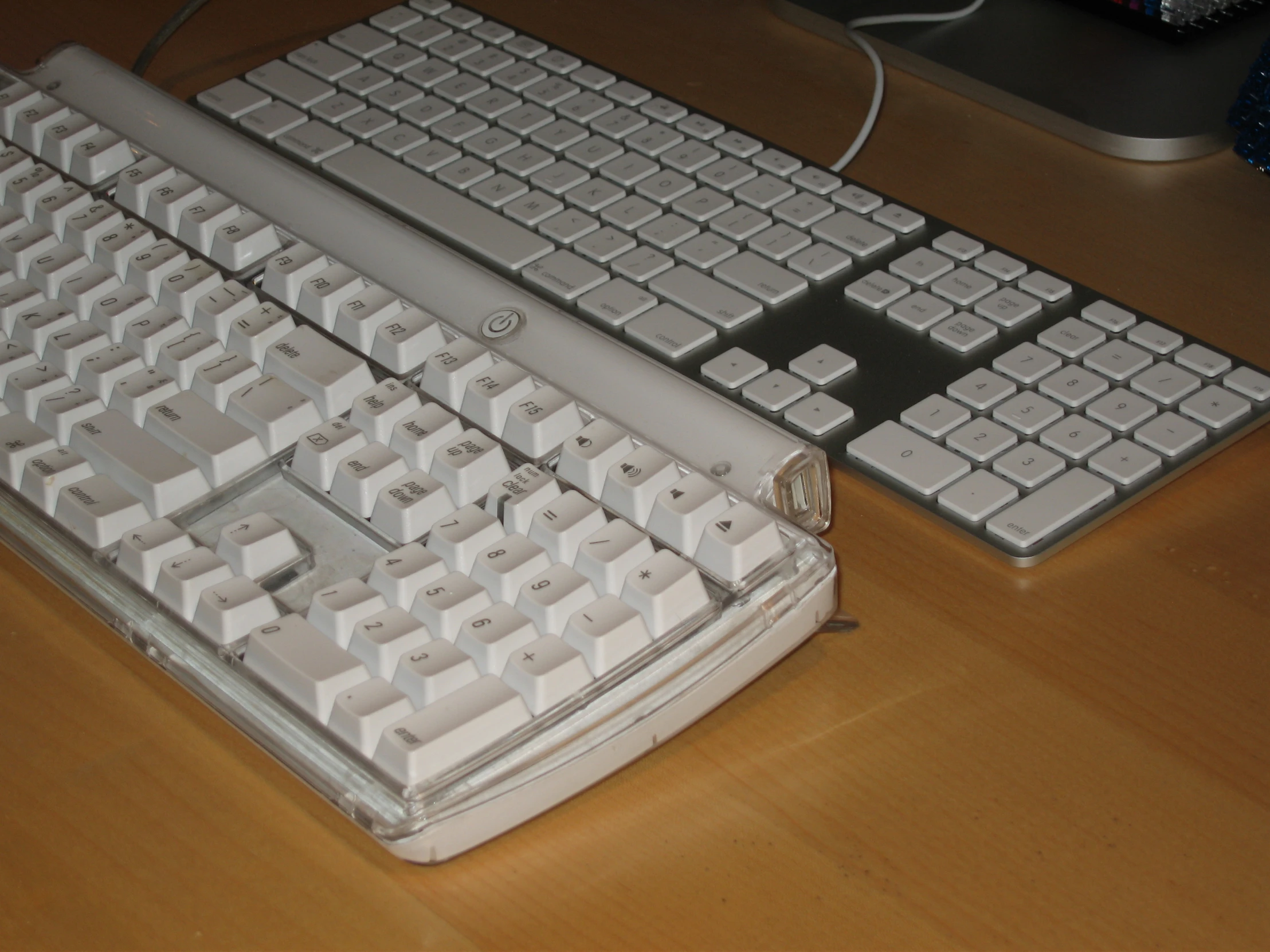 a couple of keyboards that are sitting on a desk