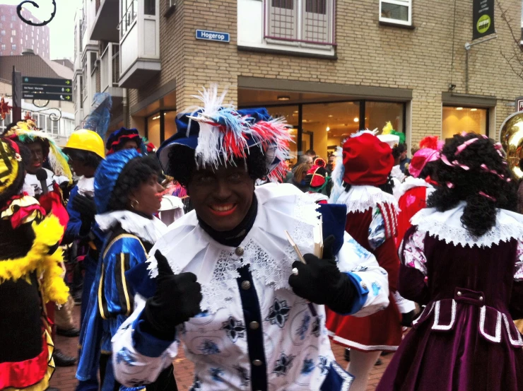 man dressed as clowns on street next to buildings