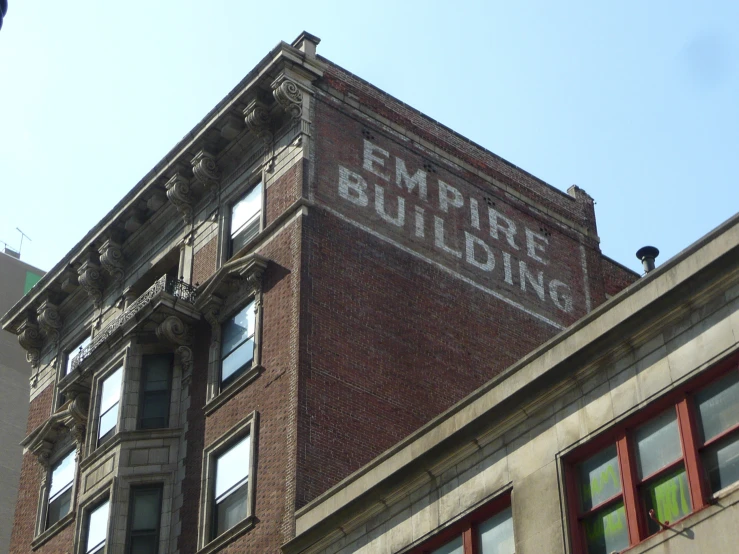 an old building with the words empire building painted on it