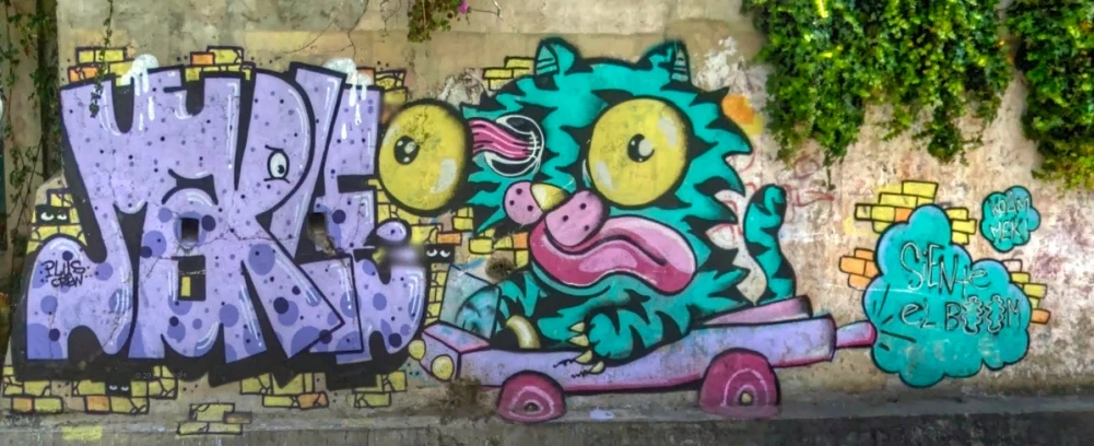 a graffiti wall is covered in street art