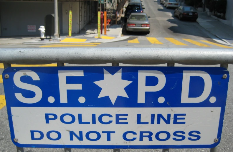 a road sign showing that police line do not cross