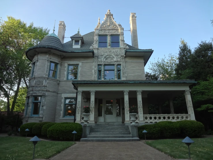 a house with many dormers on a sunny day