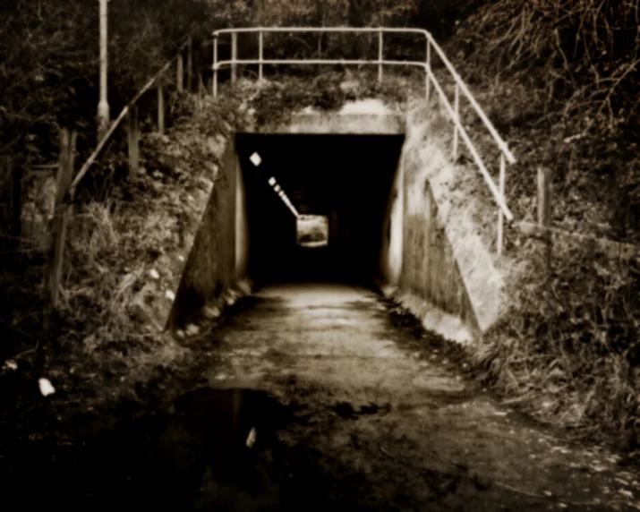 a very dark and creepy tunnel that is under construction