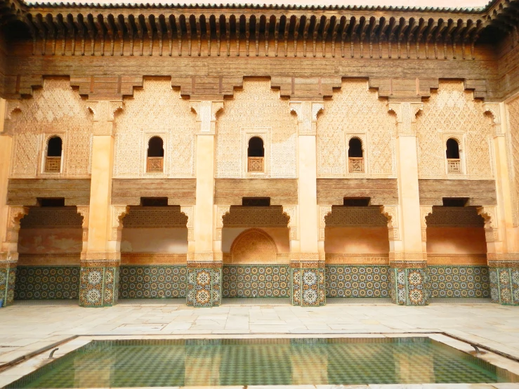 a couple of pillars next to a pool