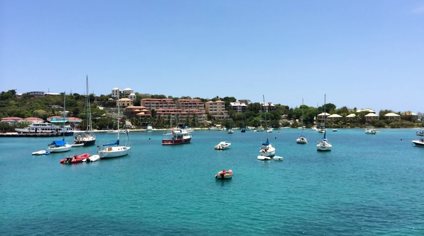 the boats are in the water near buildings