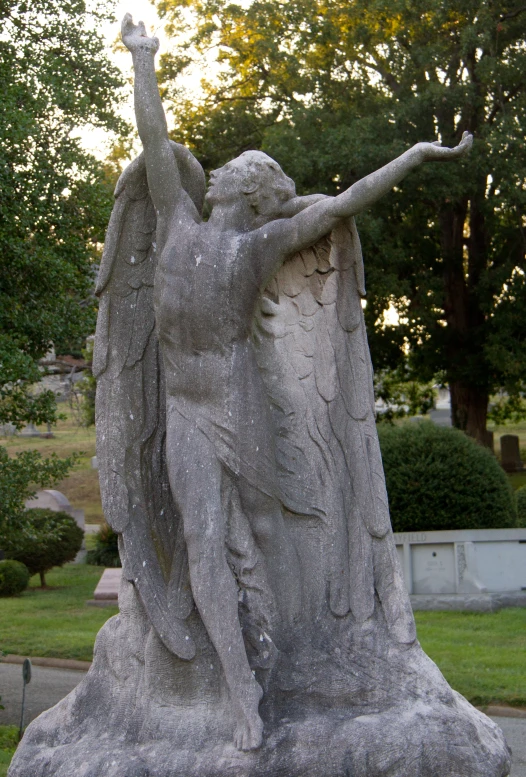 there is a statue with the head and arm in the shape of an angel